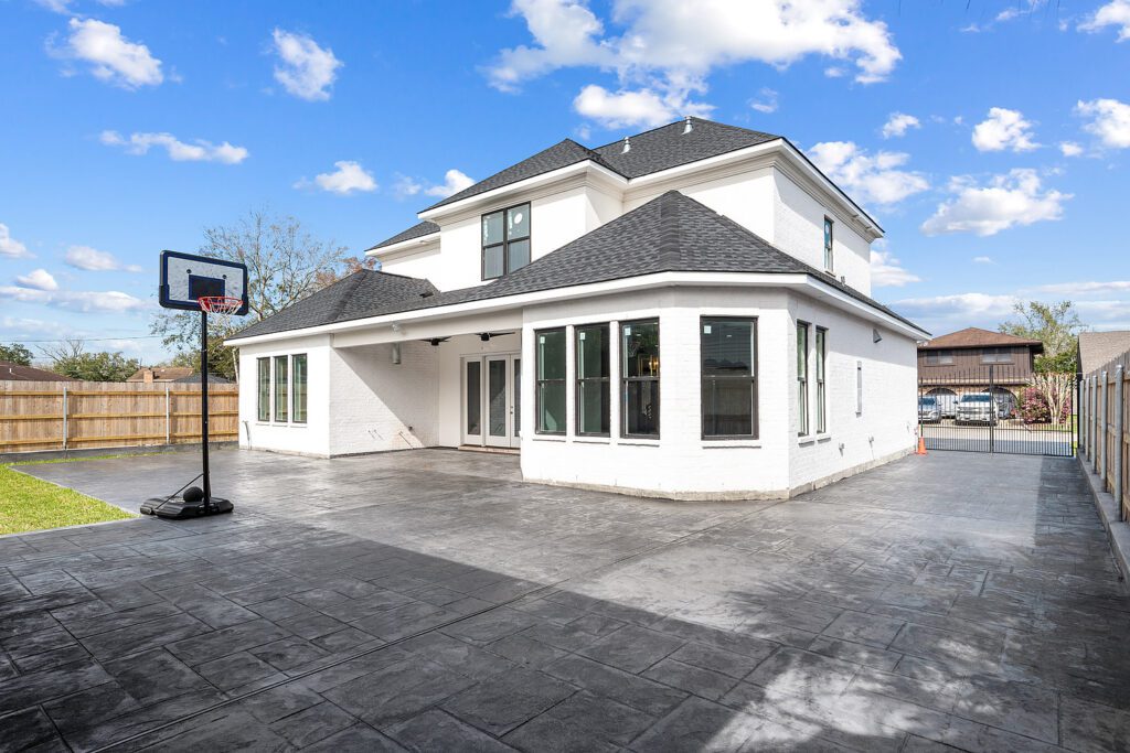 Backyard with concrete driveway