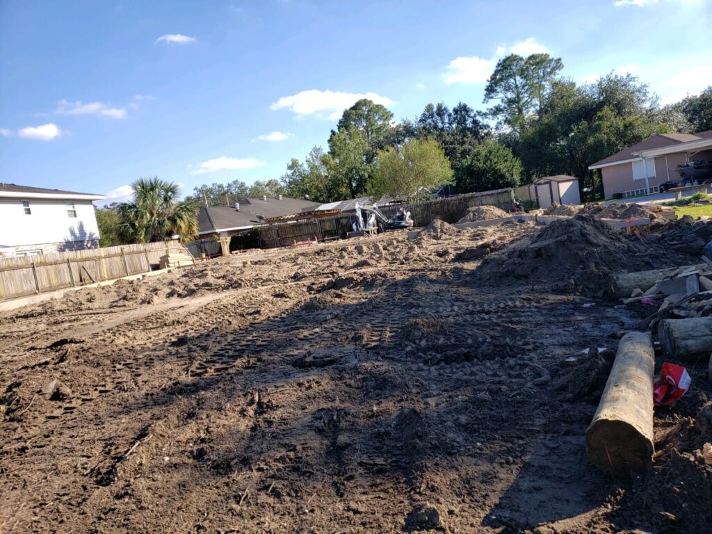 During Home Build with wood pilings prepared for Foundation