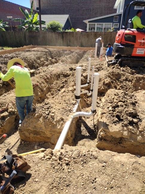 During Duplex Build working on piping next to trenches