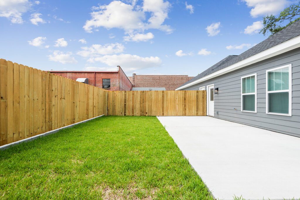 Duplex Home Builder shows backyard towards other duplex home