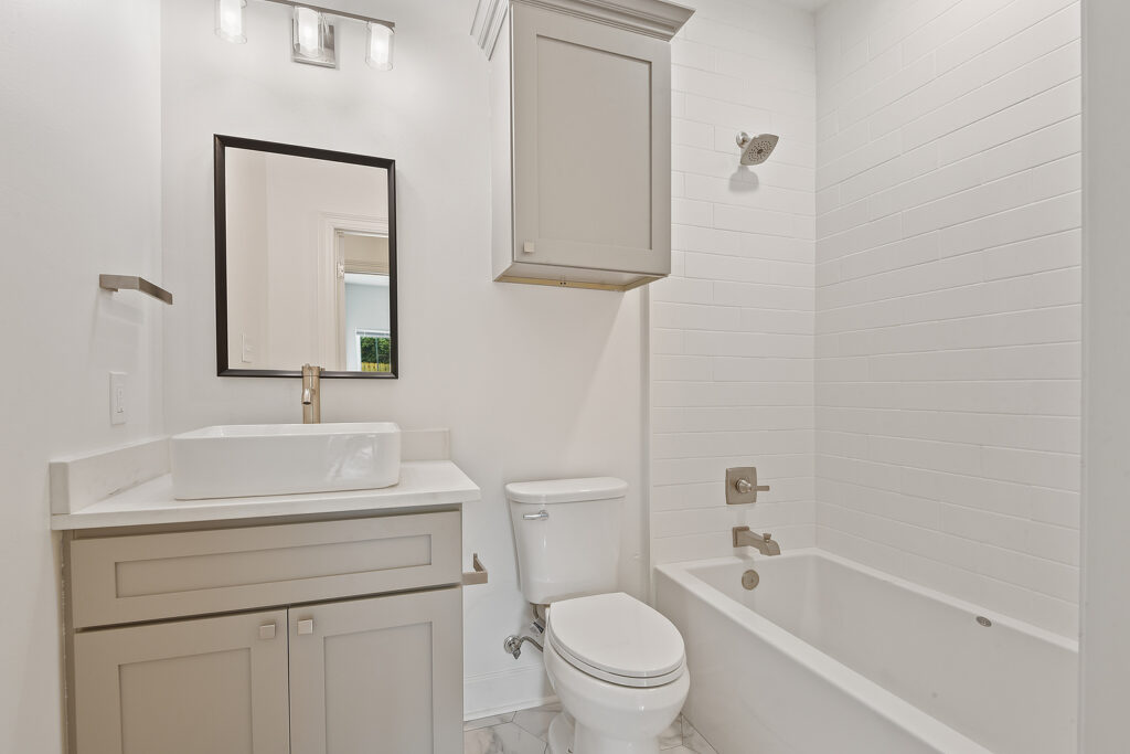 Duplex Home Builder shows full hallway Bathroom
