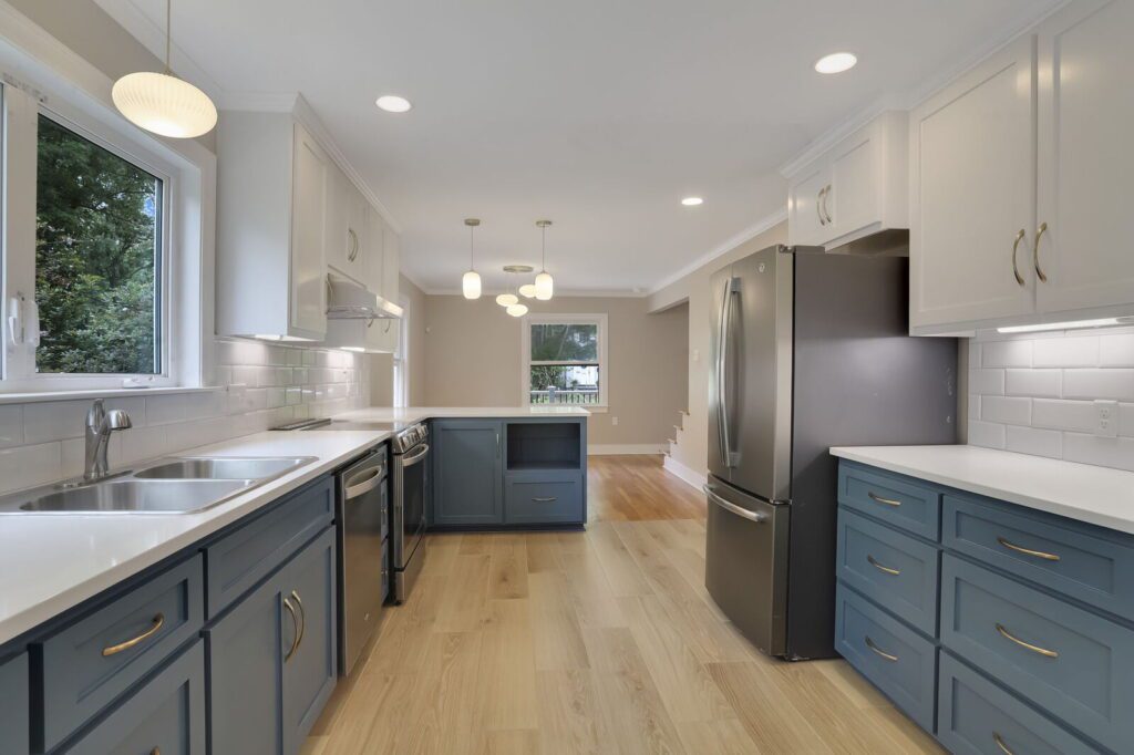 Newly remodeled kitchen expanded with plank tile floors